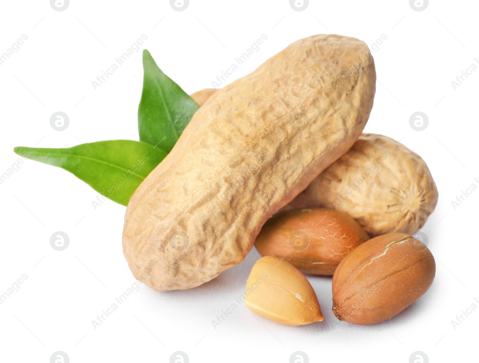 Photo of Raw peanuts and leaves on white background. Healthy snack