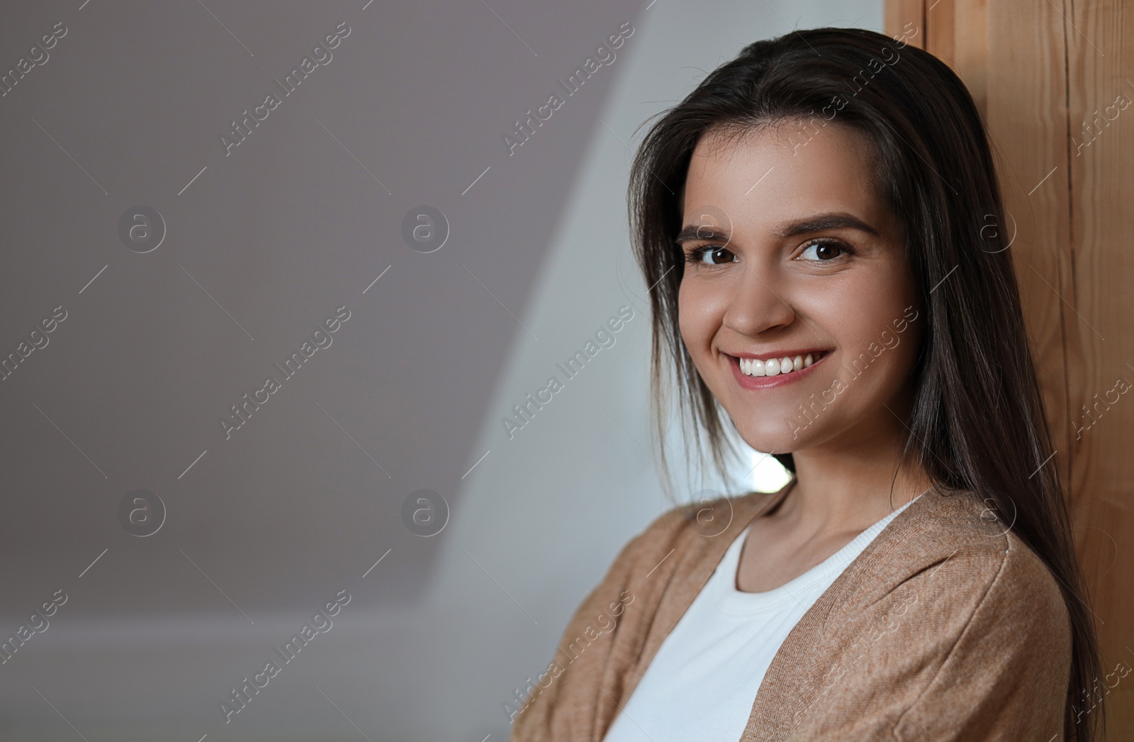 Photo of Portrait of beautiful young woman indoors, space for text