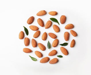 Photo of Composition with organic almond nuts on white background, top view