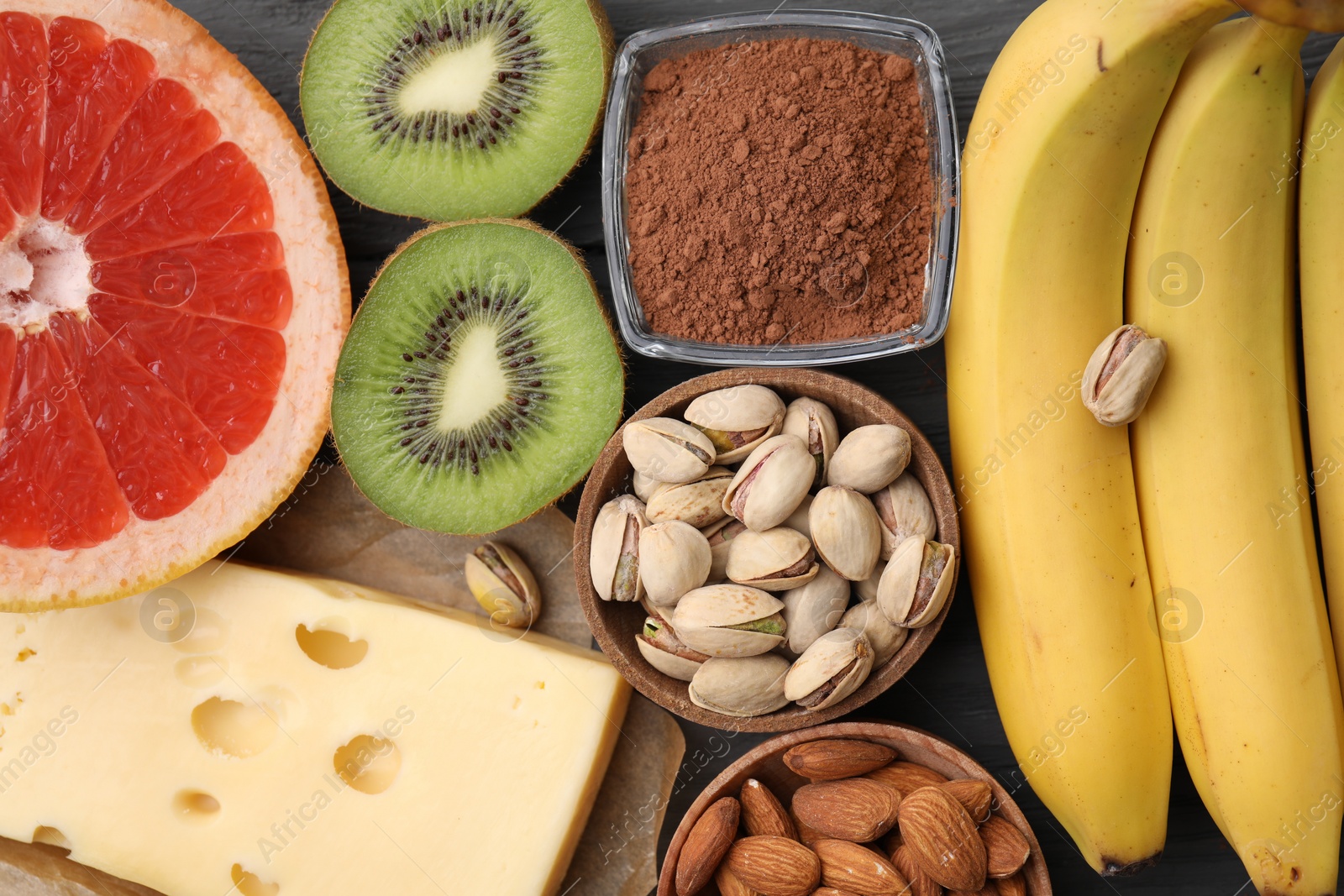 Photo of Many different products on table, flat lay. Natural sources of serotonin