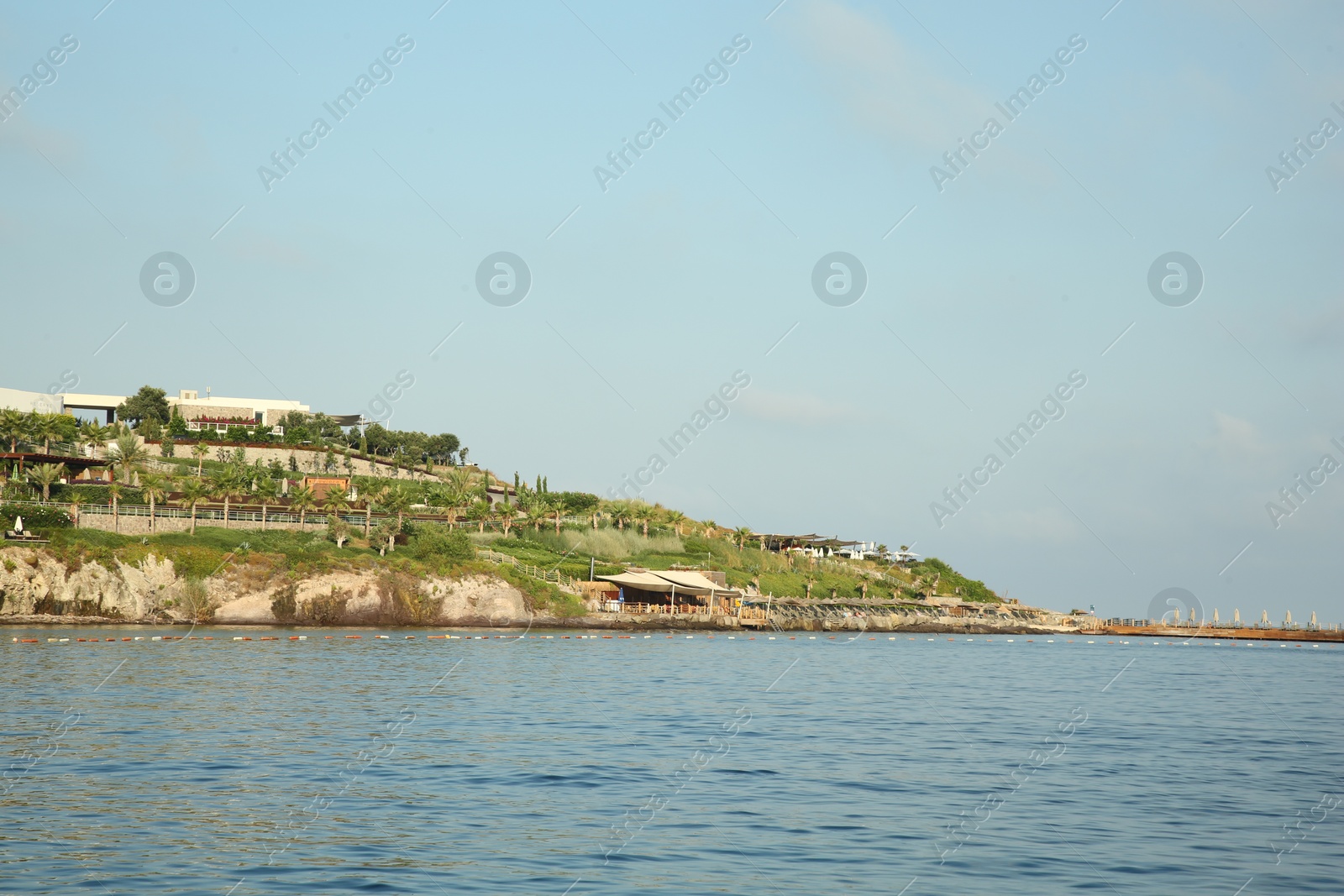 Photo of Picturesque view of sea and shore under blue sky