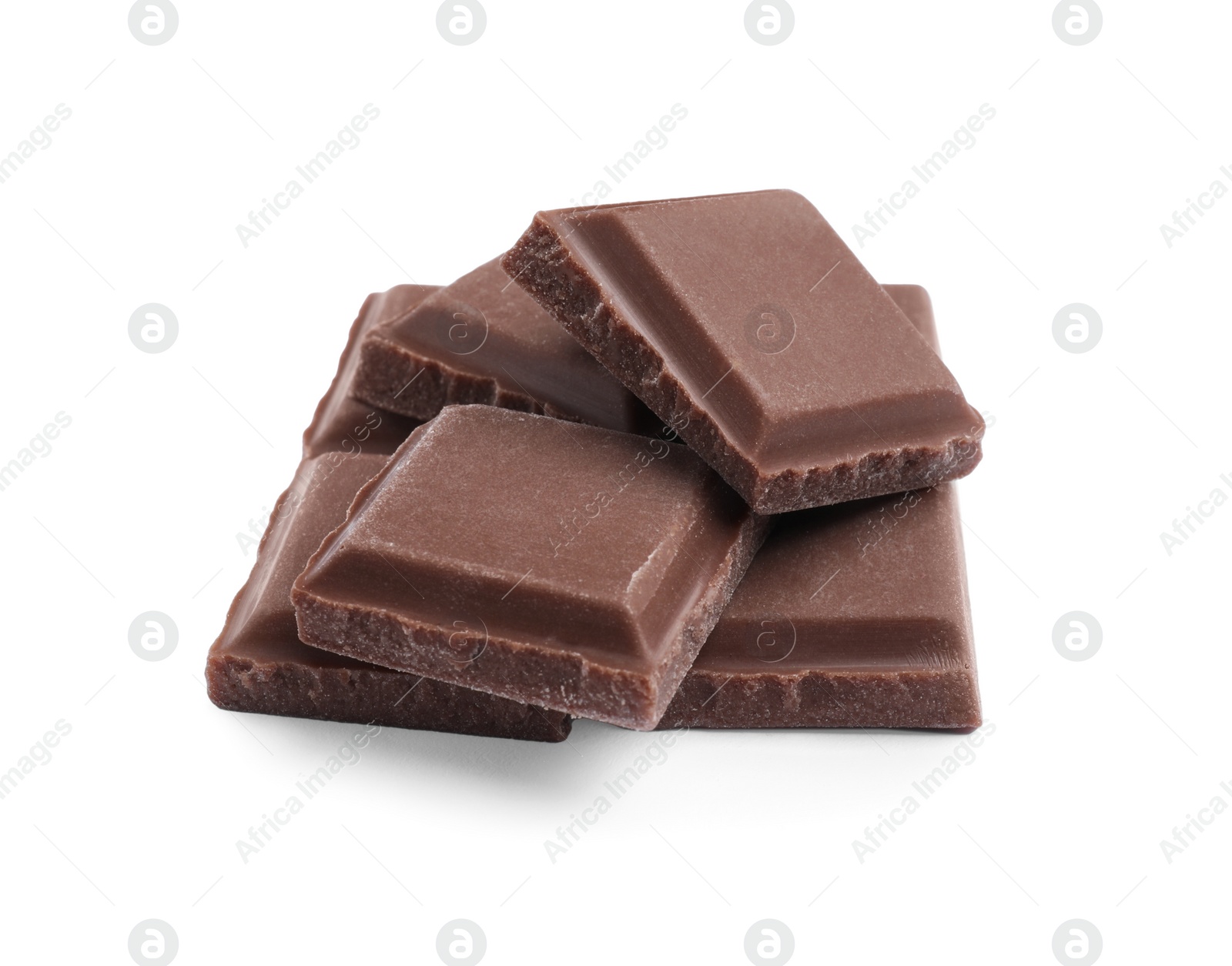 Photo of Pieces of delicious milk chocolate bar on white background