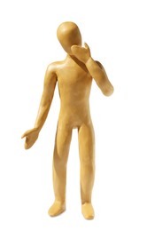 Photo of Human figure holding hand over mouth made of yellow plasticine isolated on white