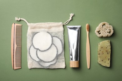 Photo of Flat lay composition with eco friendly products on green background. Conscious consumption