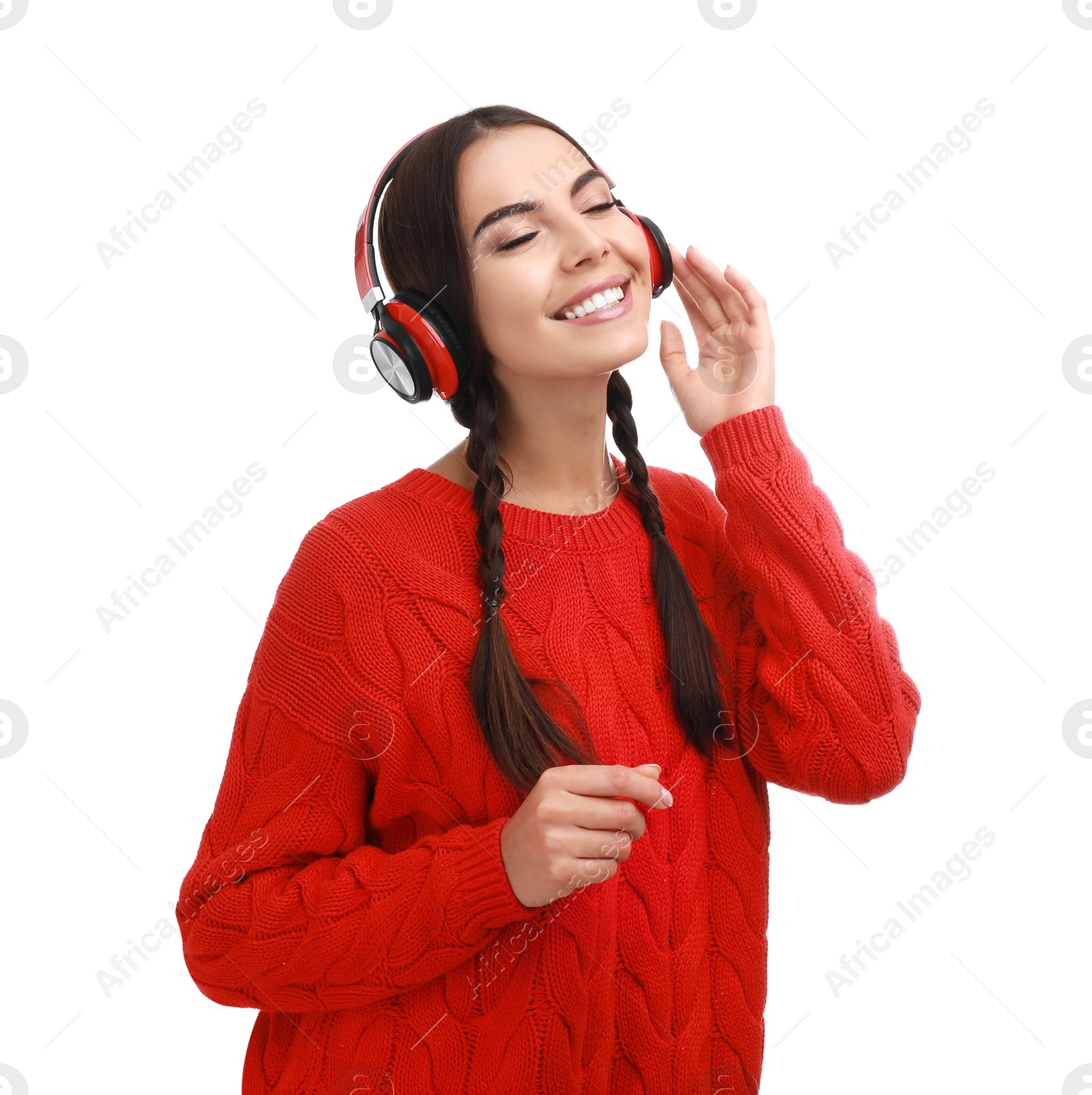 Photo of Young woman listening to music with headphones on white background