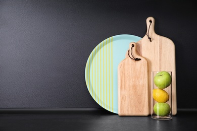 Photo of Composition with kitchenware and fruits on table against grey background. Space for text