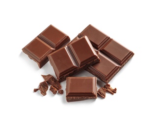 Photo of Pieces of tasty milk chocolate on white background