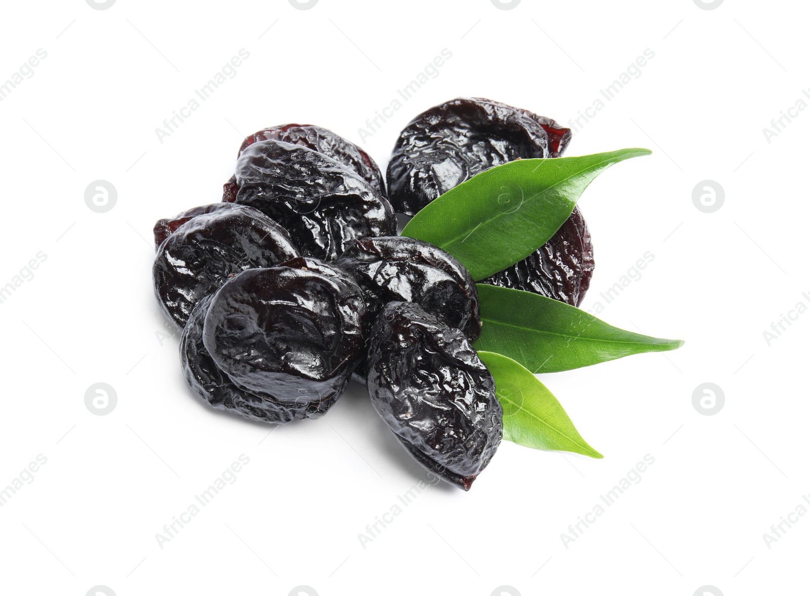 Photo of Tasty prunes and leaves on white background. Dried fruit as healthy snack