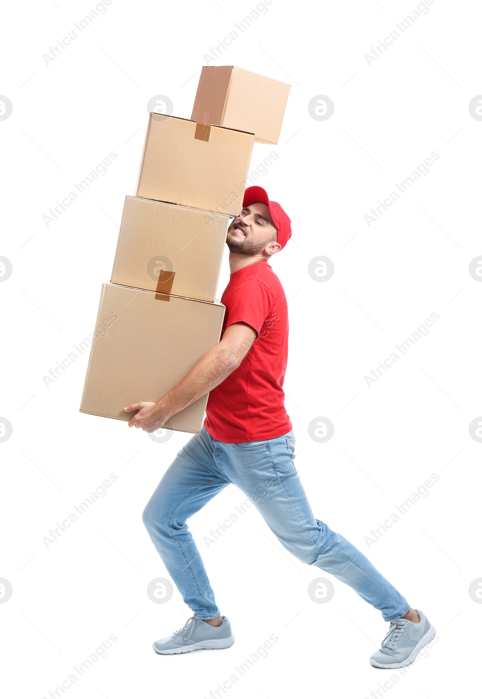 Photo of Full length portrait of man in uniform carrying boxes on white background. Posture concept