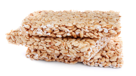 Photo of Delicious rice crispy treats on white background