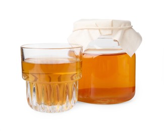 Tasty kombucha in jar and glass isolated on white