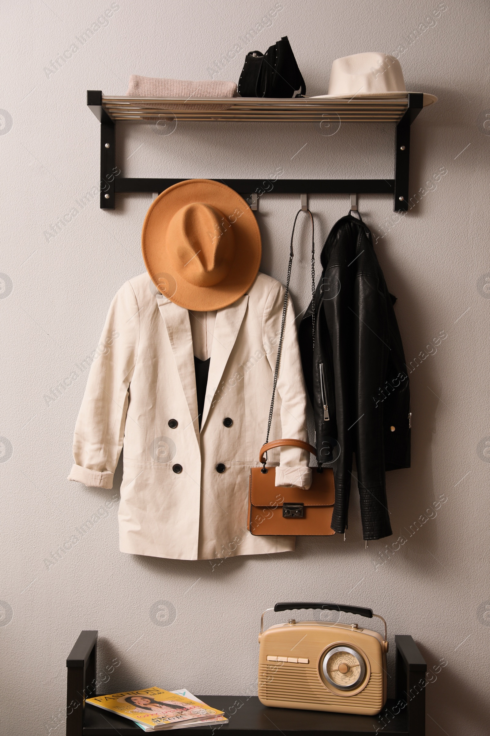 Photo of Hallway interior with stylish furniture, clothes and accessories