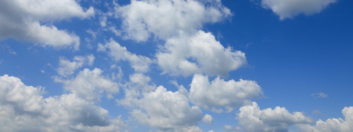 Image of Beautiful blue sky with white fluffy clouds. Banner design