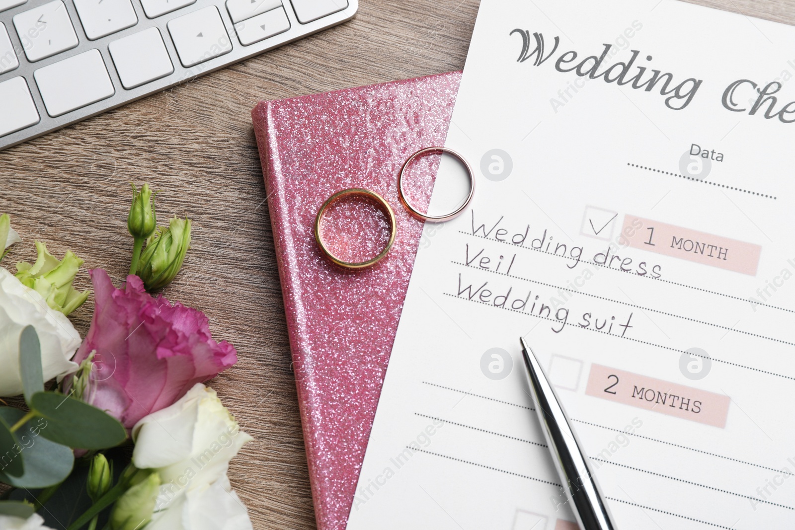 Photo of Flat lay composition with Wedding Checklist and planner on wooden table