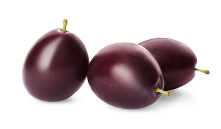 Delicious fresh ripe plums on white background