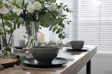 Photo of Festive table setting with beautiful tableware and decor indoors