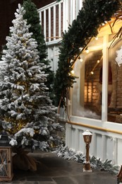 Photo of Beautiful Christmas tree and festive decor indoors. Interior design