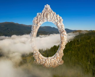 Image of Vintage frame and beautiful mountains covered with fog in morning