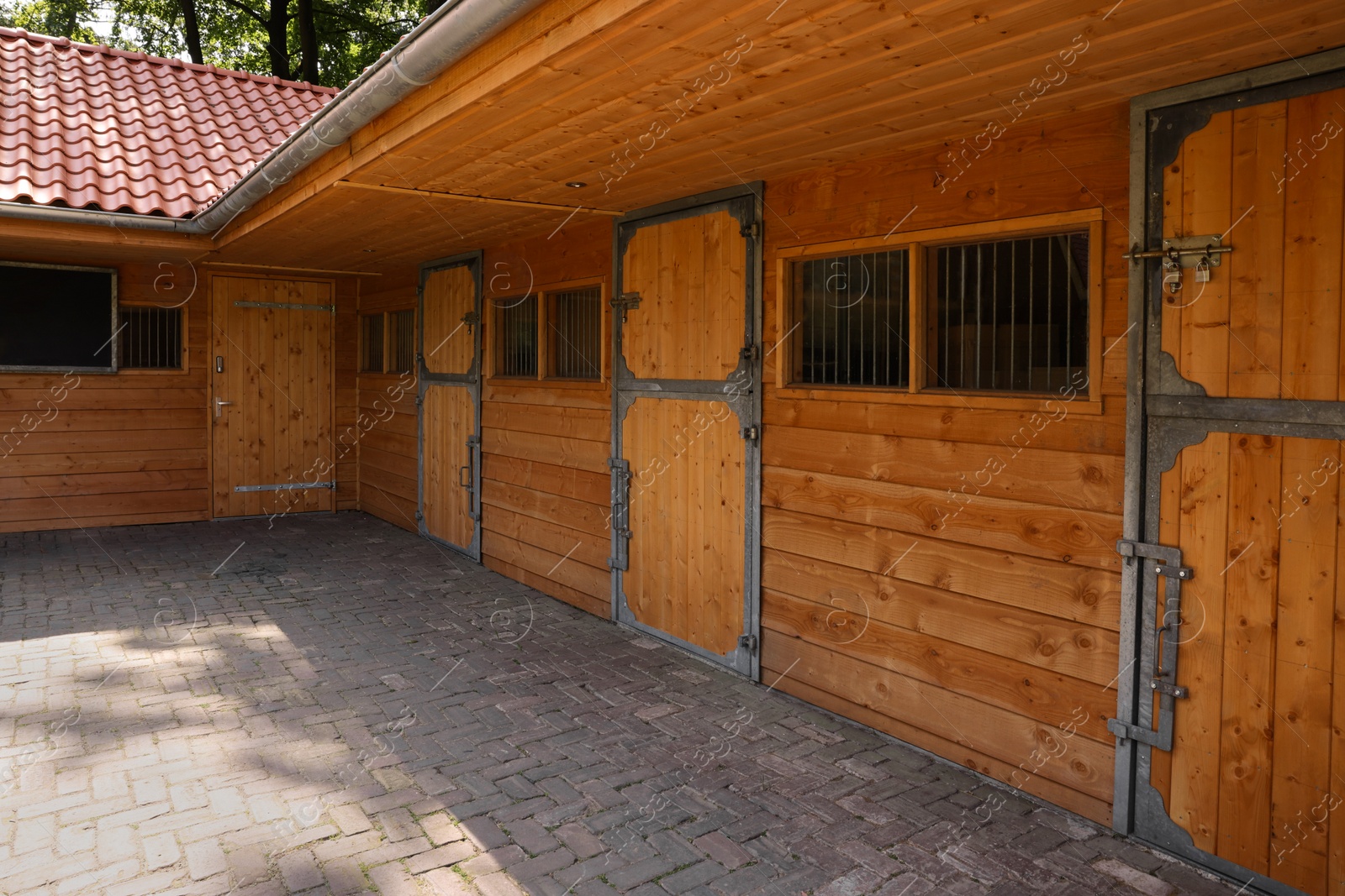 Photo of Beautiful wooden horse stable in farm outdoors