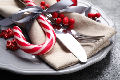 Photo of Beautiful Christmas table setting on grey background, closeup