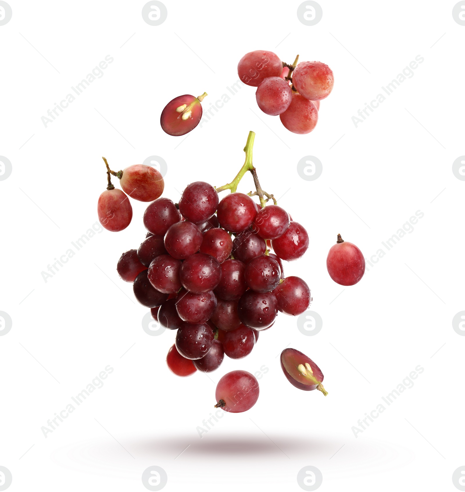 Image of Fresh ripe grapes falling on white background