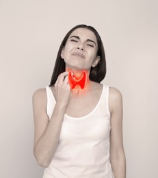 Image of Woman with thyroid gland disease on grey background