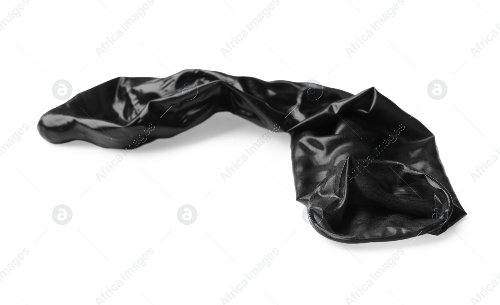 Photo of Black used condom on white background. Safe sex concept