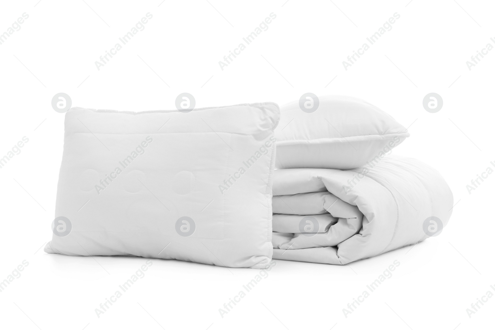 Photo of Soft blanket with pillows on white background