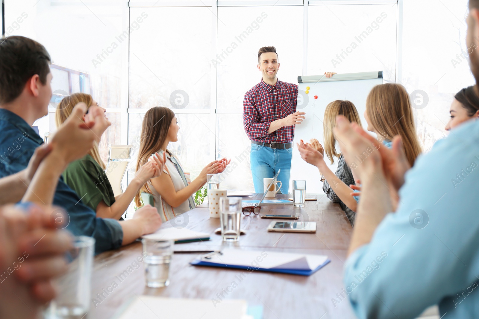 Photo of Male business trainer giving lecture in office