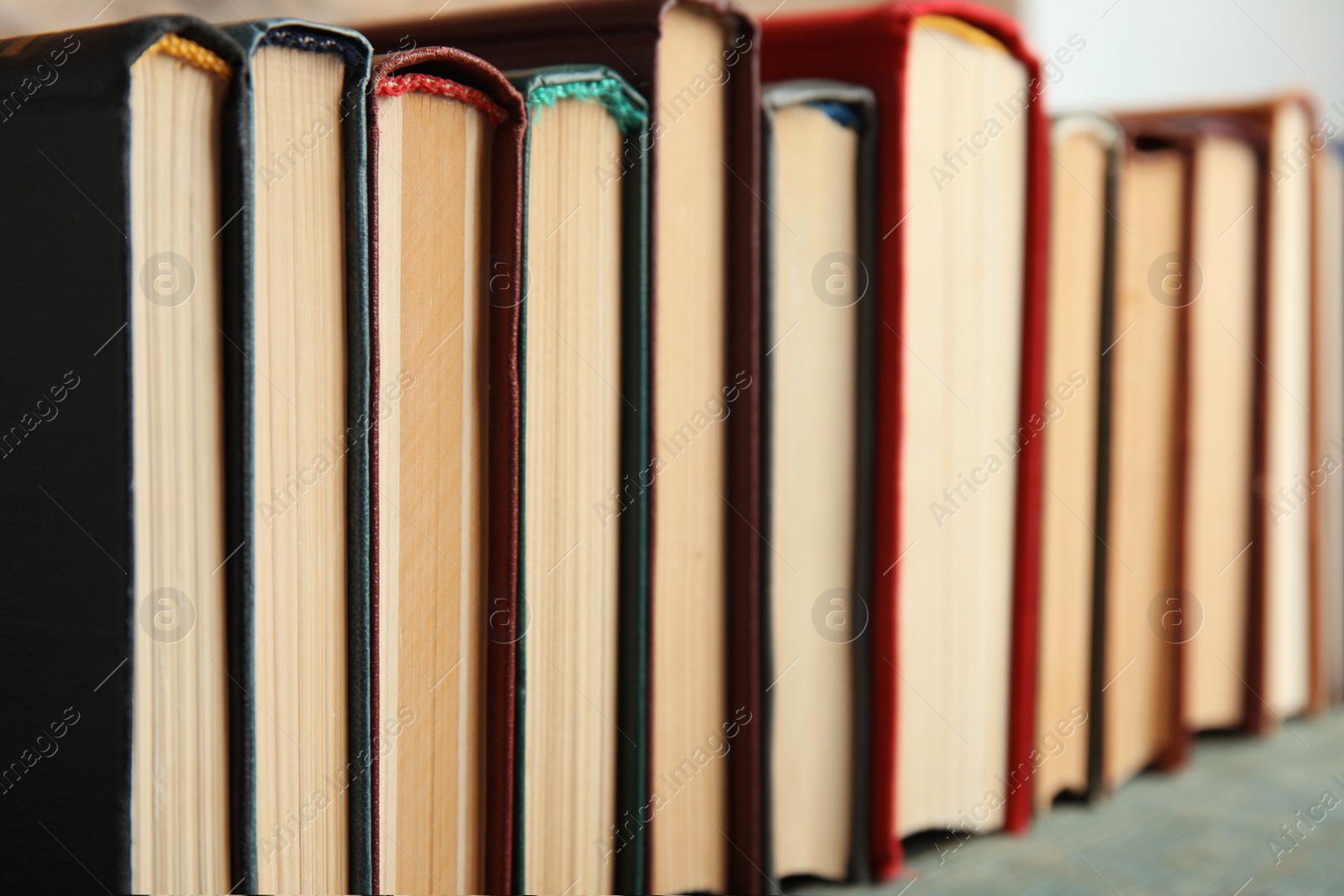 Photo of Collection of old books on shelf, closeup