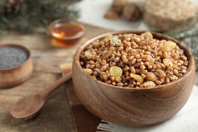 Photo of Traditional Christmas slavic dish kutia served on table, closeup