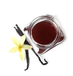 Photo of Vanilla extract, flower and dry pods isolated on white, top view