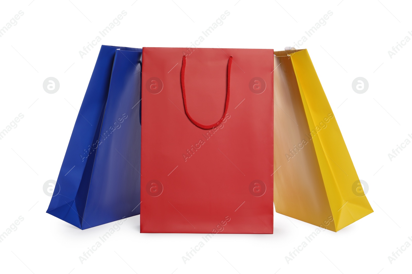 Photo of Colorful paper shopping bags isolated on white