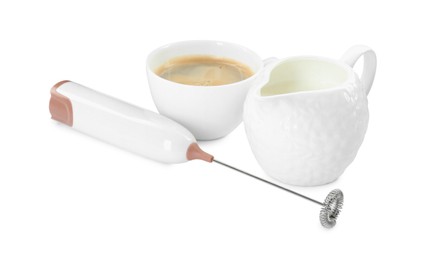 Mini mixer (milk frother), cup of coffee and pitcher isolated on white