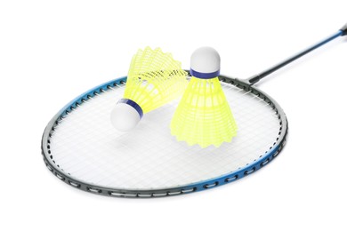 Photo of Badminton racket and shuttlecocks on white background
