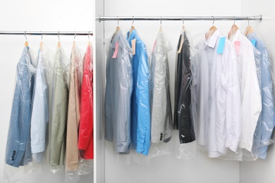 Racks with clean clothes after dry-cleaning on hangers in wardrobe