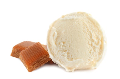 Delicious ice cream with caramel candies on white background