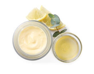 Jar of body cream with ingredients on white background, top view