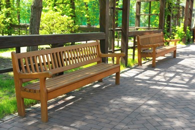Photo of Beautiful view of wooden bench in park
