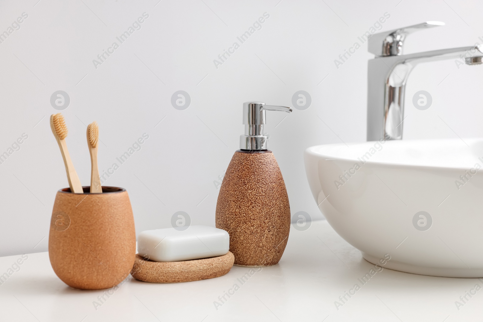 Photo of Set of different bath accessories and products on white table