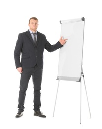 Business trainer giving presentation on flip chart board against white background