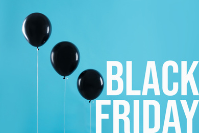 Image of Text BLACK FRIDAY and balloons on light blue background