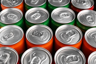 Photo of Energy drink in cans, closeup. Functional beverage