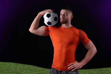 Image of Athletic young man with soccer ball on stadium