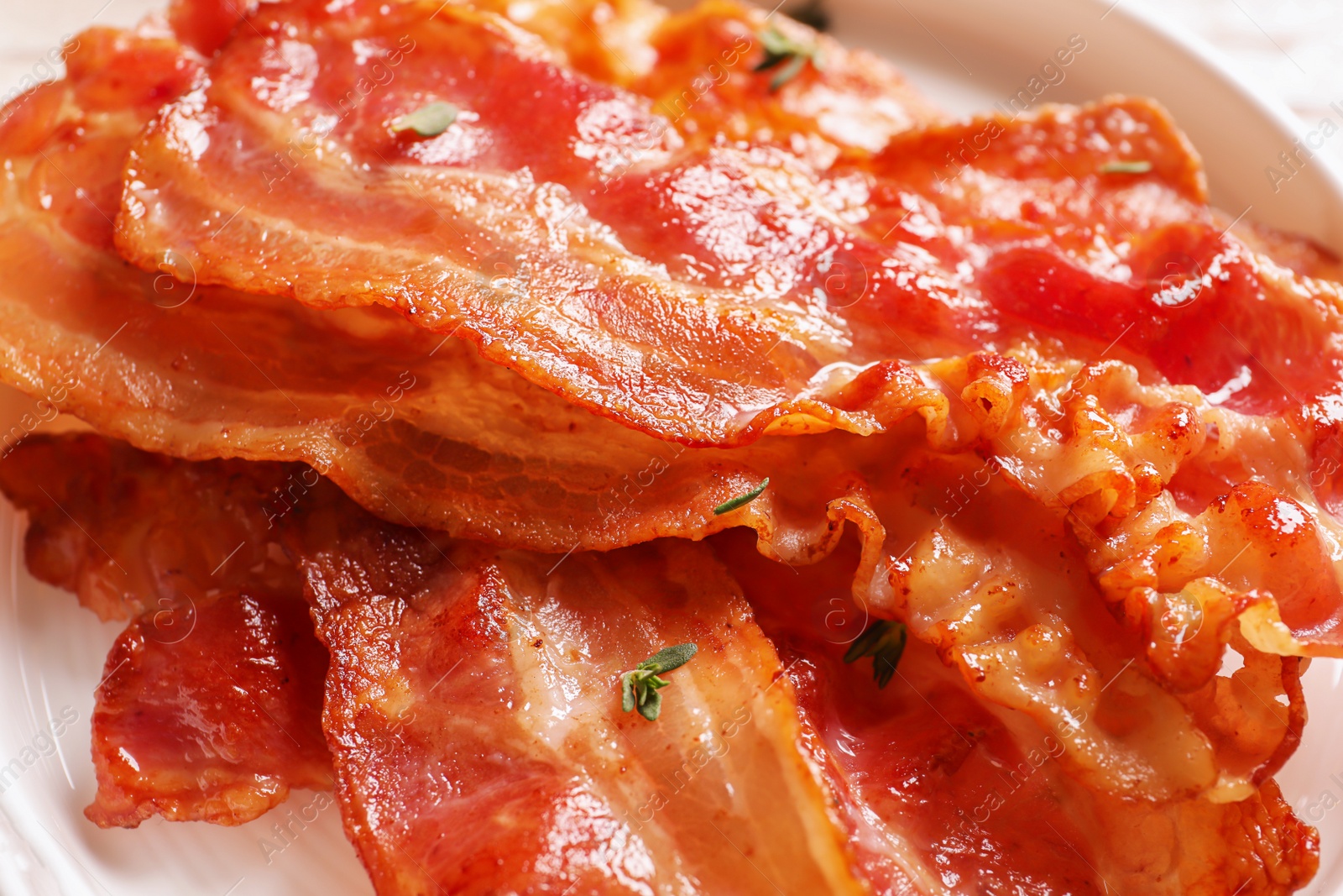 Photo of Plate with fried bacon, closeup