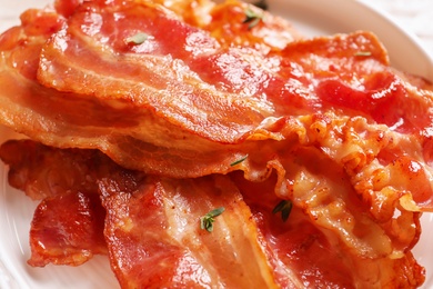 Plate with fried bacon, closeup