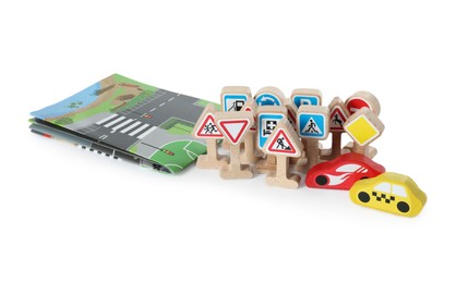 Photo of Set of wooden road signs and cars isolated on white. Children's toy