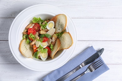 Photo of Plate with delicious fresh salad on table, top view