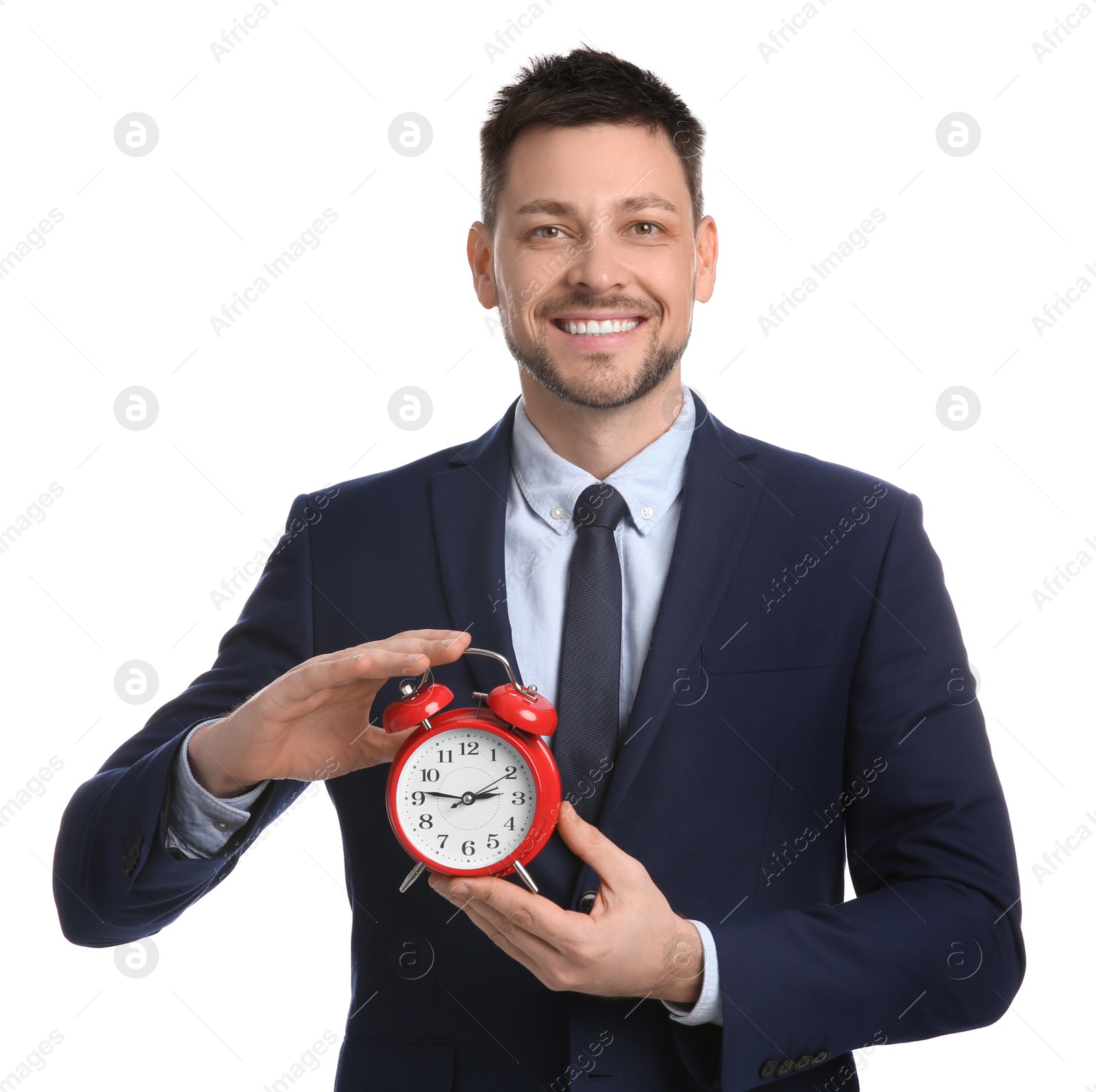 Photo of Happy businessman holding alarm clock on white background. Time management