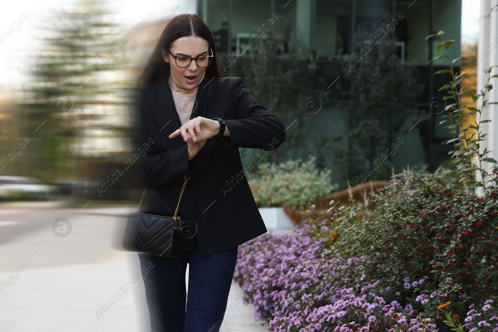 Image of Being late. Woman in hurry checking time outdoors. Motion blur effect